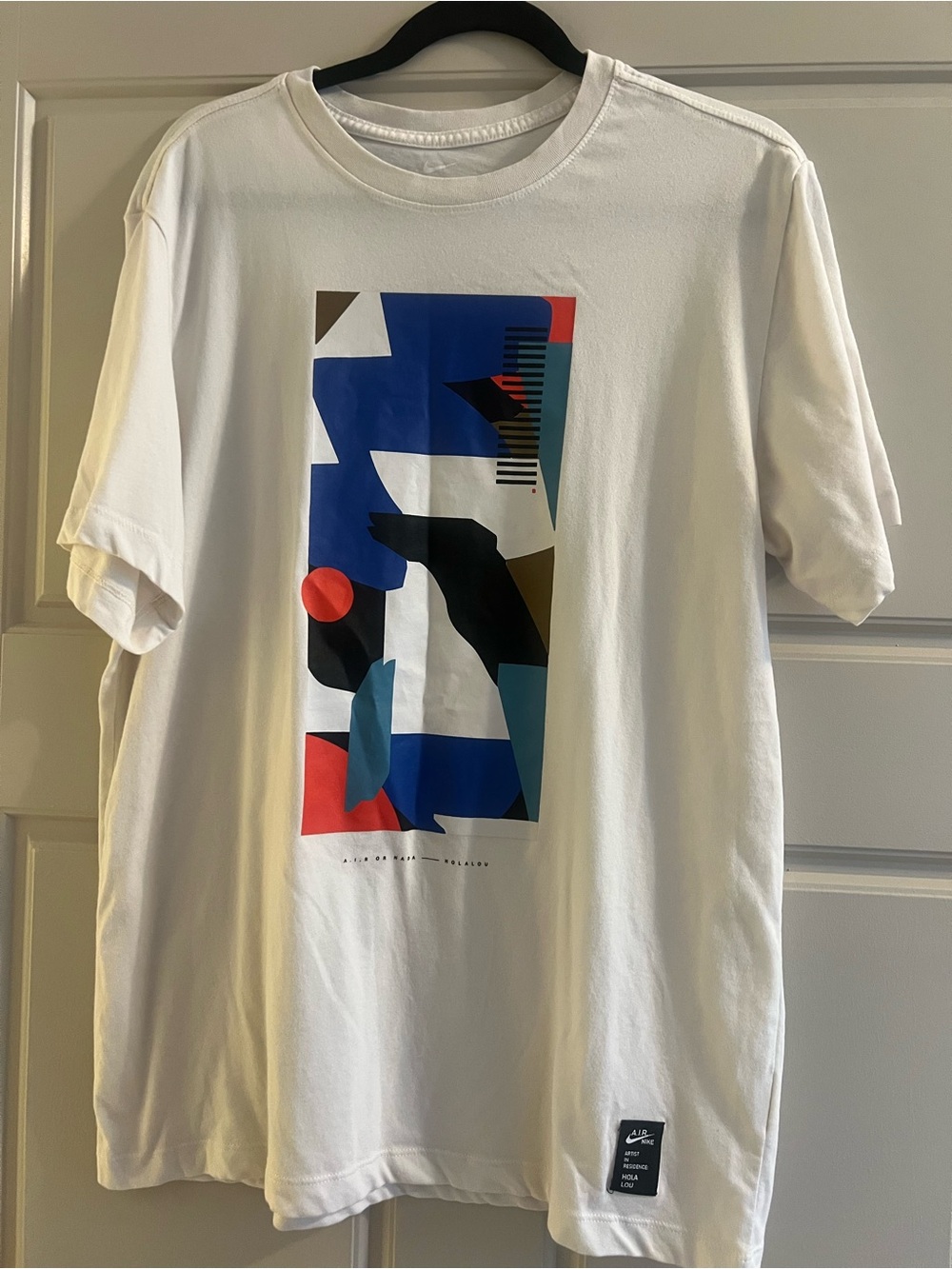 Nike White Short-Sleeve Tee with Abstract Blue, Red and Black Graphic